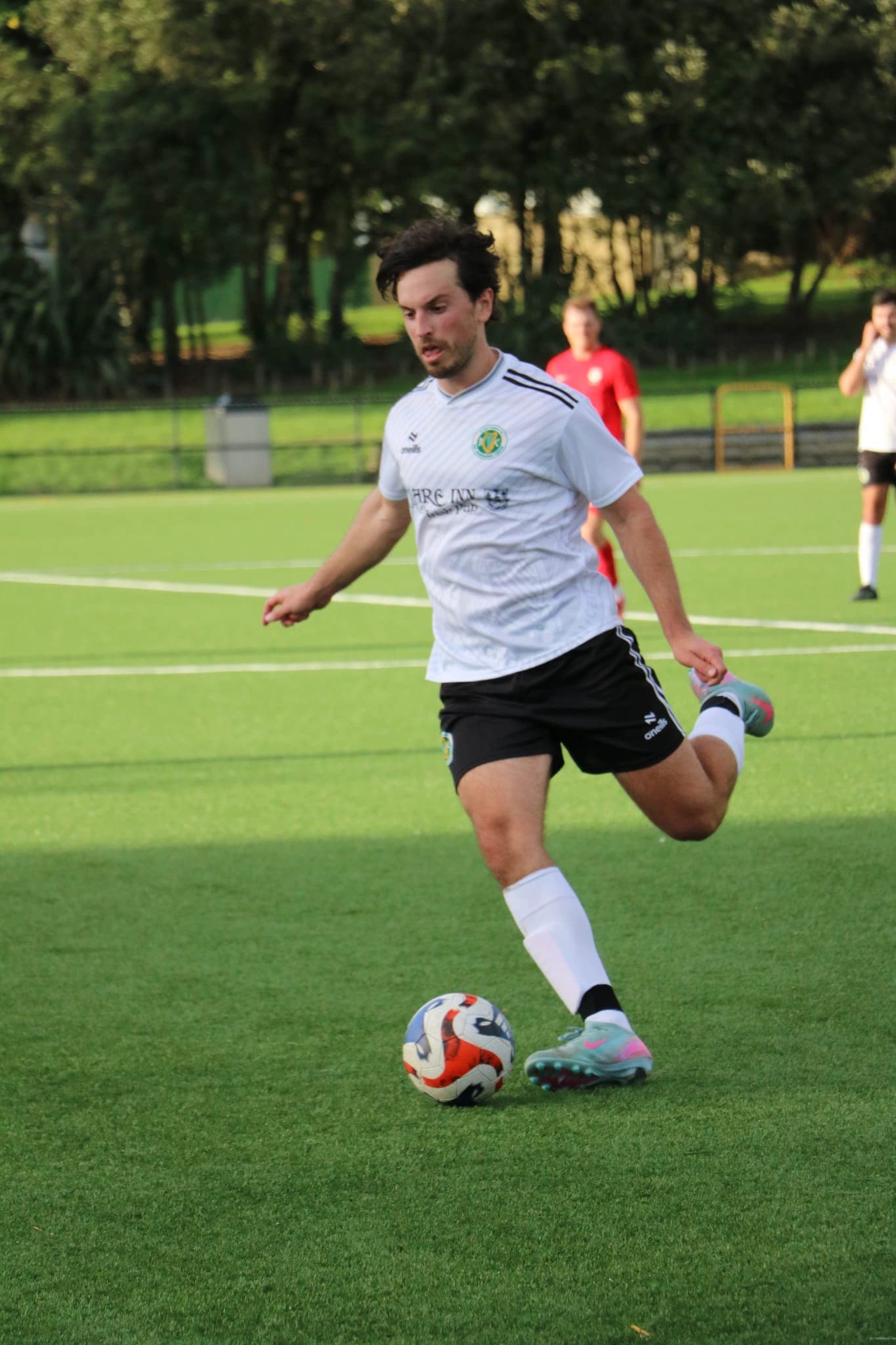 Player kicking the ball